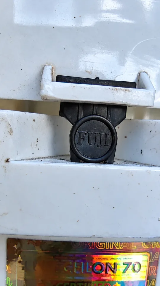 Close-up of the black FUJI lock that closes a genuine Fuji-Chlon drum